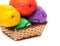 Four yarn skeins in yellow, orange, green, purple colors