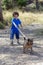 Four-year-old boy walking with his dog in a natural park