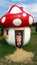 Four years old boy and toadstool house in a park