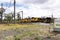 Four yellow coal train engines parked in Central Queensland..