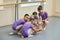 Four young ballerinas in ballet class.