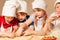 Four young chefs having fun making homemade cookie