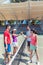 Four young tennis players putting hands together before a doubles match