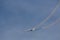 A Fournier RF4 motor glider trailing smoke from the wing tips