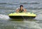 Fourteen year-old Amerasian boy tubing on Grand Lake in Oklahoma.