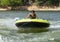 Fourteen year-old Amerasian boy tubing on Grand Lake in Oklahoma.