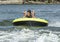 Fourteen year-old Amerasian boy tubing on Grand Lake in Oklahoma.