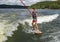 Fourteen year-old Amerasian boy wake surfing on Grand Lake in Oklahoma.