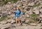 Fourteen year-old Caucasian girl with a snowball on a trail in Mount Rainier National Park, Washington