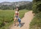 Fourteen year-old Caucasian girl standing happily on a trail in Mount Rainier National Park, Washington