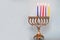 Fourth day of Hanukkah with burning Hanukkah colorful candles in Menorah.Chanukkah-jewish holiday.