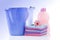 Fower, towels and laundry detergent isolated