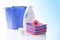 Fower, towels and laundry detergent isolated