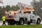 FPL Florida lights and power electric service work truck on the side of the road in rainy day