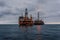 FPSO tanker vessel near Oil Rig platform. Offshore oil and gas industry