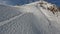FPV drone dynamic shot ski resort people riding on slope track skiing snowboarding