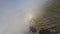 FPV sport drone dive shot tropical island volcano ridge smoke panorama stone 4k