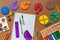 Fractions, rulers, pencils, notepad on brown background. Set of supplies for mathematics and for school.