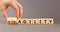 Fragility or agility symbol. Concept words Fragility and Agility on wooden cubes. Businessman hand. Beautiful grey table grey