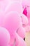Fragment of arch decorated with pink air balloons and ribbons, birthday party, girl& x27;s baby shower, wedding, valentine