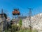 Fragment of barbed wire mounted above prison fence,