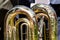 Fragment of big brass tuba. part of music instrument.