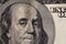 A fragment of a bill of 100 US dollars. Portrait of Benjamin Franklin