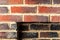 Fragment of a brick wall fireplace with a rectangular niche