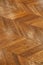 Fragment of brown wooden parquet floor