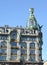 Fragment of the building of House of Books against the background of the sky. St. Petersburg. The Russian text - the Zinger Compan