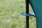 Fragment of a camping chair. Stands on the grass of a summer meadow