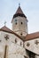 Fragment of the church and the watchtower with the clock of the Fortified Church Prejmer in Prejmer city in Romania