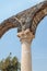 Fragment of a column in ruins of Kursi - a large Byzantine 8th-century monastery on the shores of Lake Tiberias, on the Golan Heig