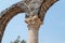 Fragment of a column in ruins of Kursi - a large Byzantine 8th-century monastery on the shores of Lake Tiberias, on the Golan Heig