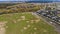 Fragment of cottage village near the empty field for future building