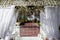 Fragment of creatively decorated wedding arch outdoors