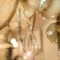 A fragment of the crystal decor of a drop hanging on the transparent glass armature