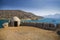 Fragment of a defense tower and walls in the Spinalonga fortress. Sea view from the leper island in Greece