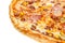 Fragment of delicious classic italian pizza with ham, sausages, corn, cucumbers and cheese
