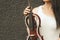 A fragment of an electric violin, a violin in the hands of a musician\'s girl.