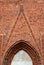 Fragment of the entrance portal of the building of the High Knight`s Castle of the Teutonic Order. Malbork, Poland