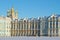 Fragment of the facade of the Catherine Palace with the domes of the Resurrection Church on a sunny February day. Tsarskoye Selo,