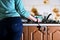 Fragment of the female body, handcuffed to the kitchen counter,