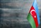 Fragment of the flag of Azerbaijan in the foreground blurred light background copy space