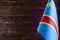 Fragment of the flag of the Democratic Republic of the Congo in the foreground space for text blurred background