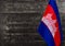 Fragment of the flag of the Kingdom of Cambodia in the foreground blurred background copy space