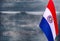 Fragment of the flag of Paraguay in the foreground blurred light background copy space
