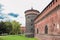 Fragment of fortress wall and corner tower of Sforzesco Castle