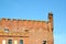 A fragment of the fortress wall of Shaaken Castle with a nest of storks on a corner tower, XIII century. Kaliningrad region