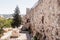 Fragment of the fortress walls and Zion Gate street near to the Zion Gate in the old town in Jerusalem, Israel